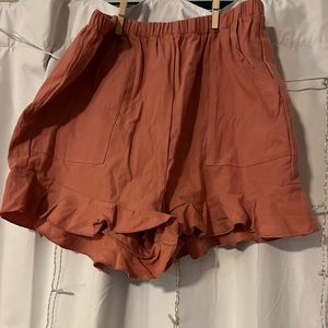 Pink flowy shorts with pockets